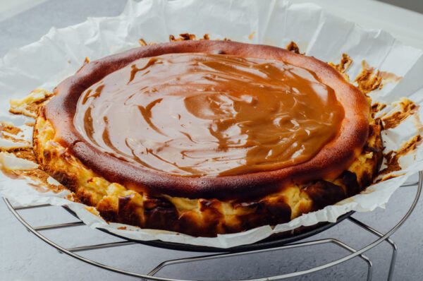 Dulce de leche or caramel topping baked cheesecake